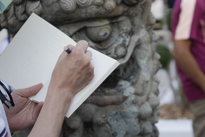 Cropped hand of woman holding hands