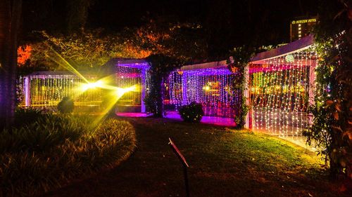 Illuminated park in city at night