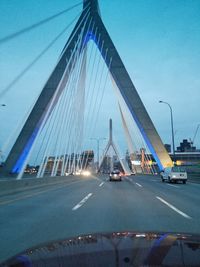 Low angle view of suspension bridge against sky