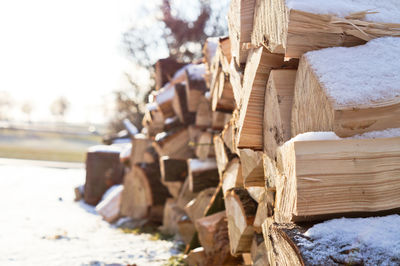 Close-up of stack of wood during winter