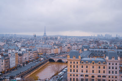 High angle view of city of paris against sky, view from notre dame cathedral.