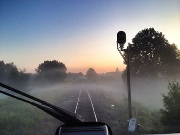 Car on road at sunset