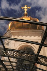 Low angle view of illuminated statue against sky