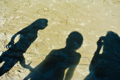 Shadow of woman on sand