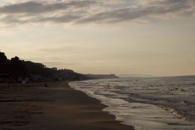 Scenic view of beach against sky during sunset