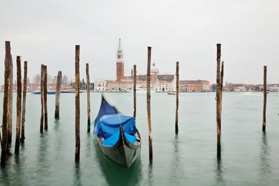 Boats moored at harbor