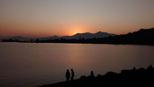 Scenic view of river against clear sky during sunrise