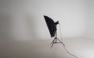 Wind turbines on floor against white background