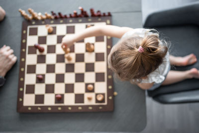 High angle view of girl playing with toys