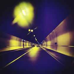 Light trails on road in tunnel