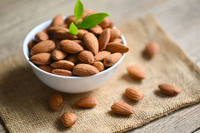 Close-up of almonds in bowls on table