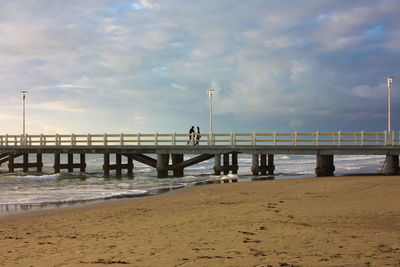 Pier over sea against sky