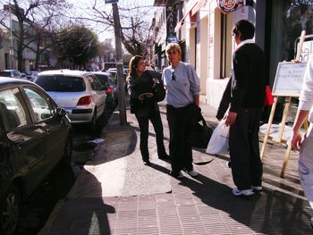 People walking in front of building