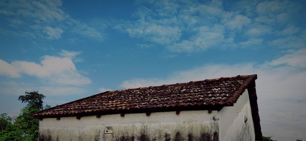 Farmhouse against sky