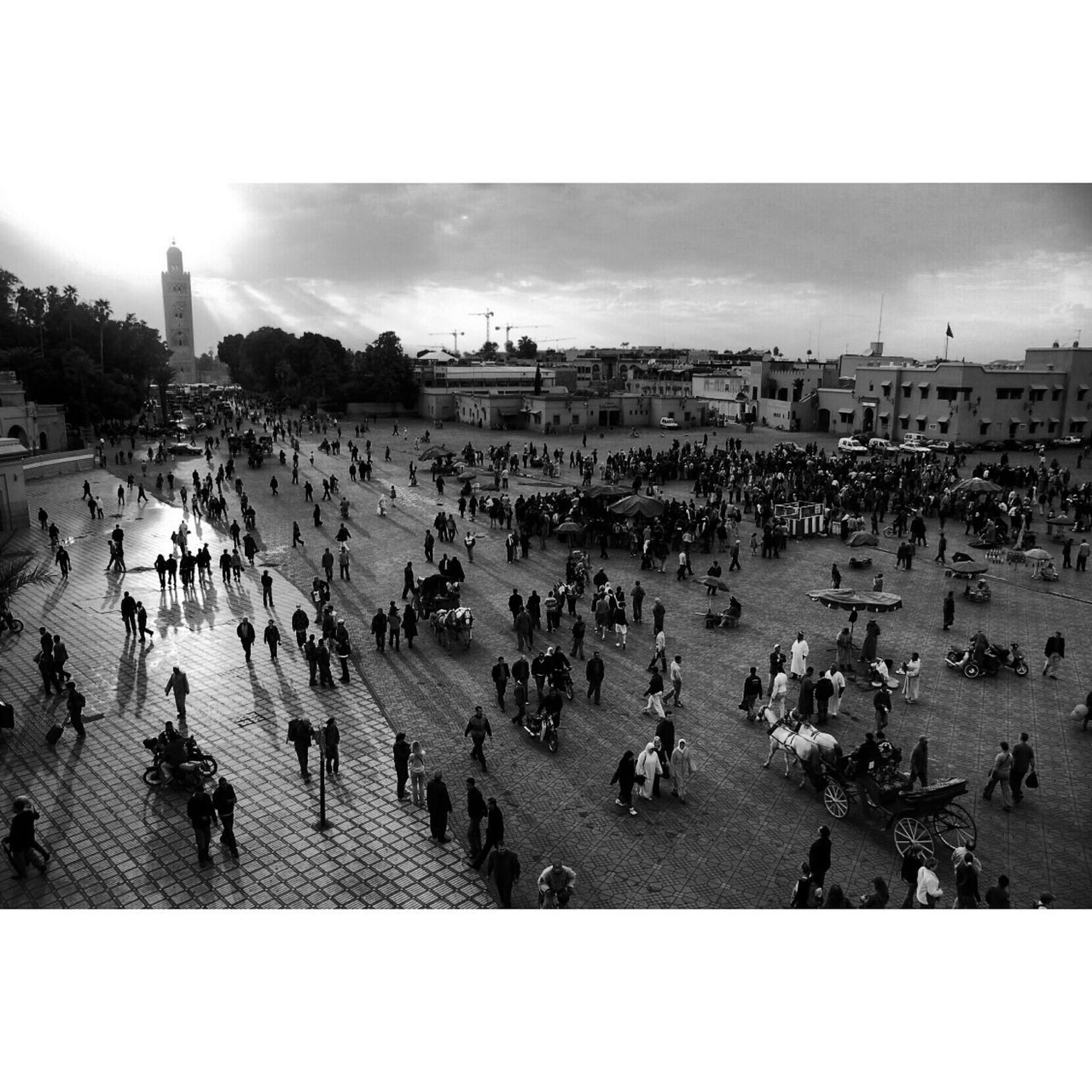 large group of people, crowd, transfer print, mixed age range, lifestyles, person, leisure activity, beach, men, auto post production filter, building exterior, architecture, crowded, high angle view, built structure, tourist, sky, sea, city life