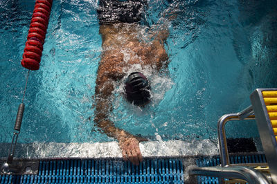 High angle view of man swimming in pool