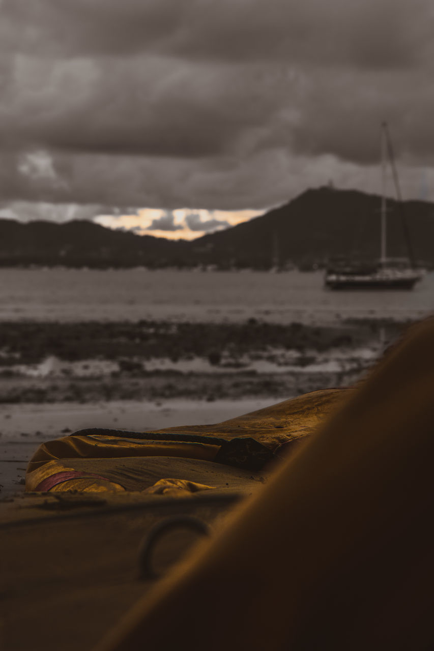 SCENIC VIEW OF BEACH AGAINST SKY DURING SUNSET