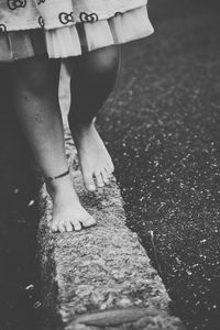 Low section of woman standing on tiled floor