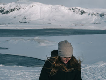 Portrait of young woman in snow