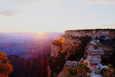 Scenic view of grand canyon against sky at sunrise