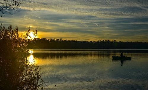 Scenic view of lake at sunset