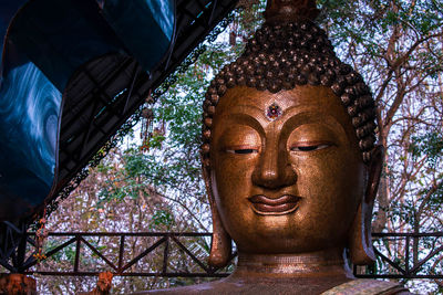 Low angle view of statue against building