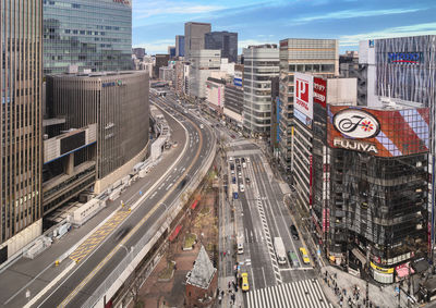 High angle view of traffic on road amidst buildings in city