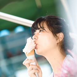 Portrait of woman holding ice cream