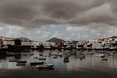 Boats moored at harbor