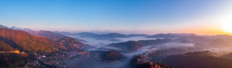 Panoramic view of mountains against sky during sunset