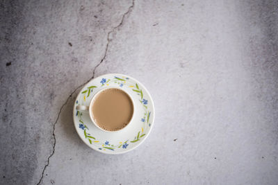 High angle view of coffee cup on table