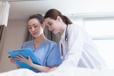 Doctor examining patient in hospital