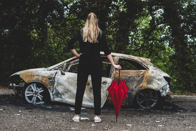 Rear view of person standing in car