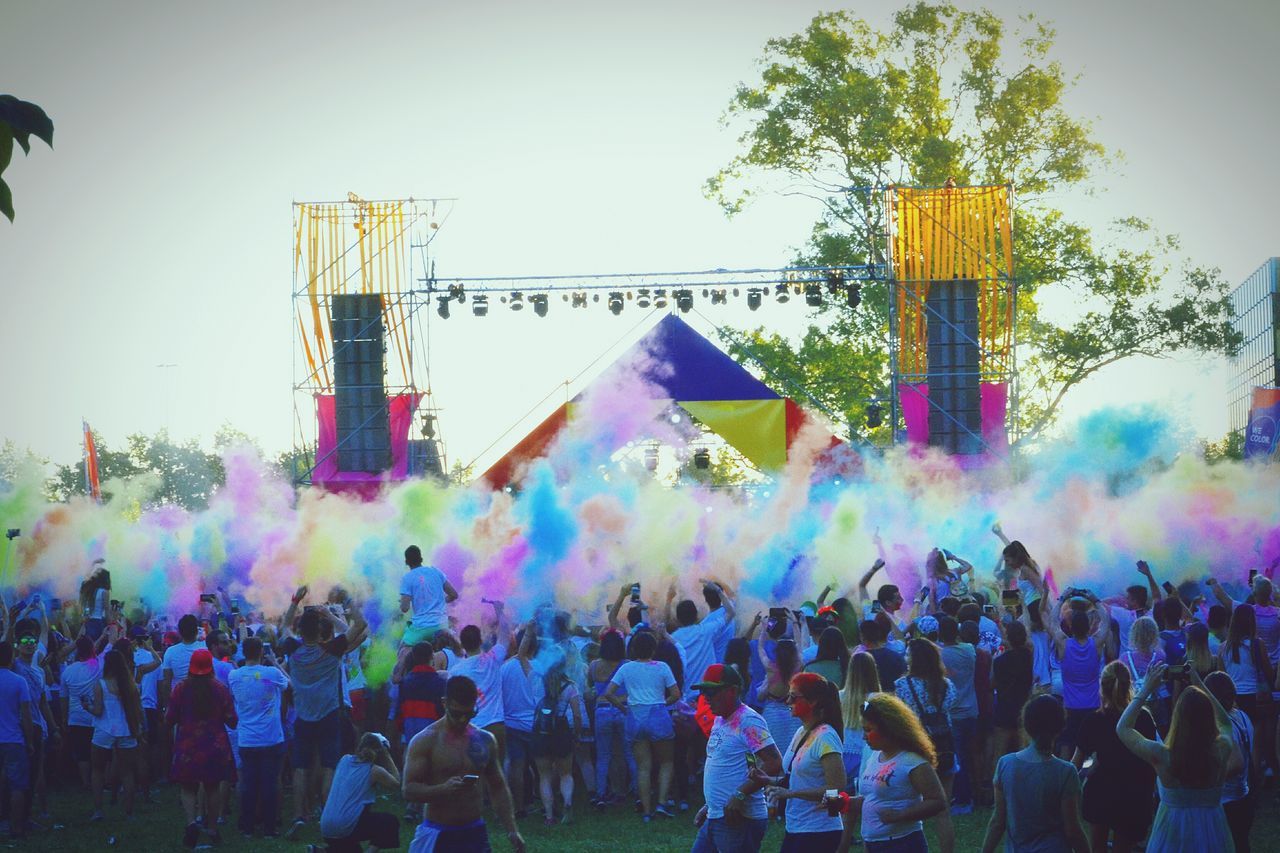 multi colored, large group of people, fun, real people, bubble, enjoyment, bubble wand, crowd, day, rainbow, outdoors, leisure activity, men, celebration, happiness, holi, powder paint, sky, people, adult