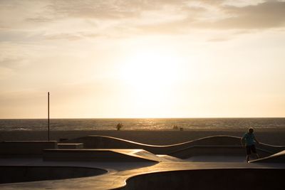 Scenic view of calm sea at sunset