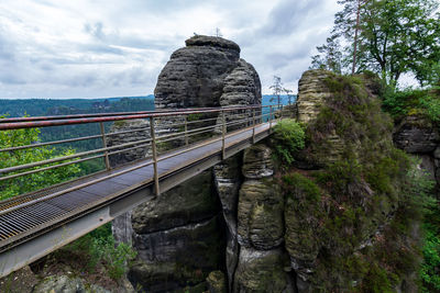 View of bridge over mountain against sky