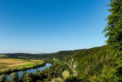 Scenic view of landscape against clear blue sky