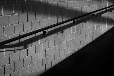 Metallic railing on wall
