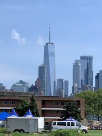 Modern buildings in city against sky