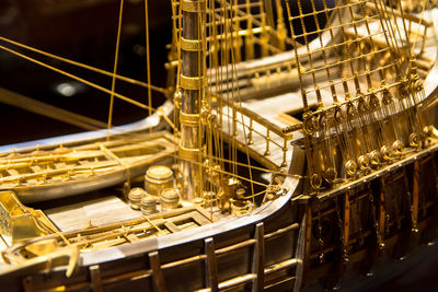 Close-up of gold caravel ship model at museum
