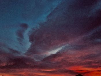 Low angle view of dramatic sky at night