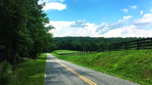 Empty country road passing through landscape