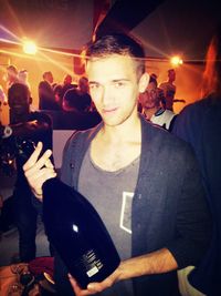 Woman standing at music concert