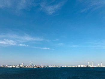 Scenic view of sea against blue sky