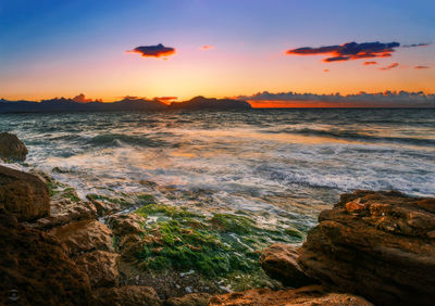 Scenic view of sea against sky during sunset