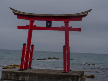 Red bell tower at sea