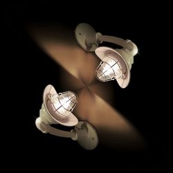 Close-up of illuminated lighting equipment against black background