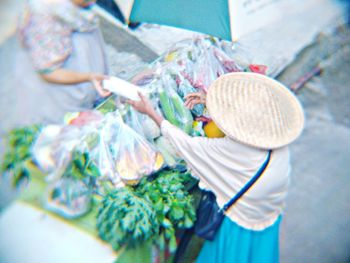 High angle view of woman holding umbrella