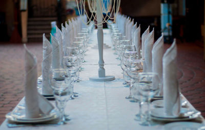 Close-up of glasses on table in restaurant