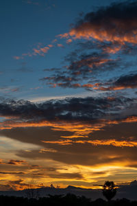 Low angle view of dramatic sky during sunset